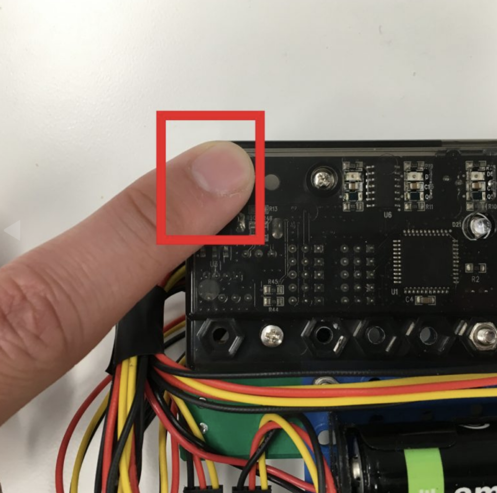 Finger covering CoDrone Pro remote sensor
